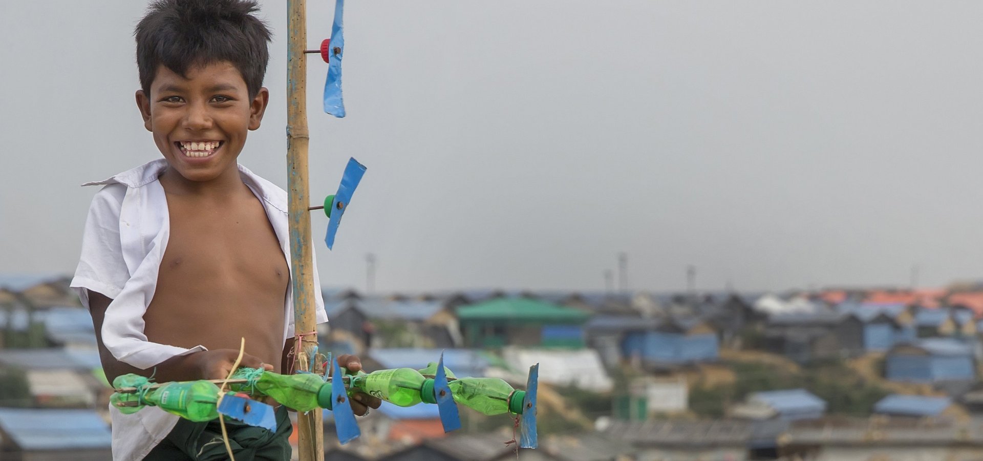 Imran Hasan,11, playing on his makeshift roof in a camp in Ukhia,Cox's Bazar.Bangladesh.